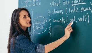 woman at chalkboard