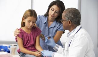 child being seen by doctor